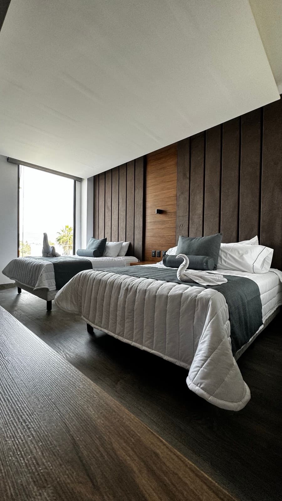 Freshly made bed in a vacation rental — hotel-style presentation